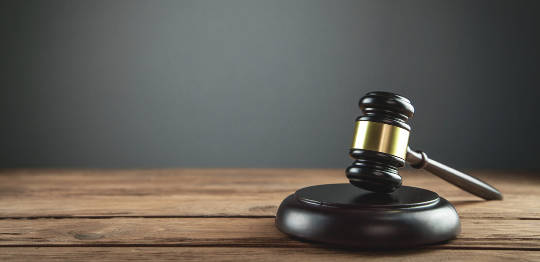 Judge Gavel on a wooden desk. Law concept